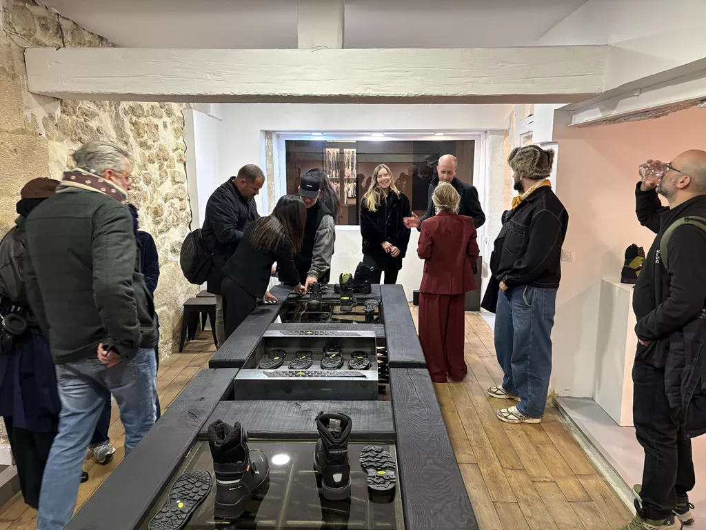 Visitors exploring safety footwear at Vibram’s Extreme Works installation during Paris Fashion Week