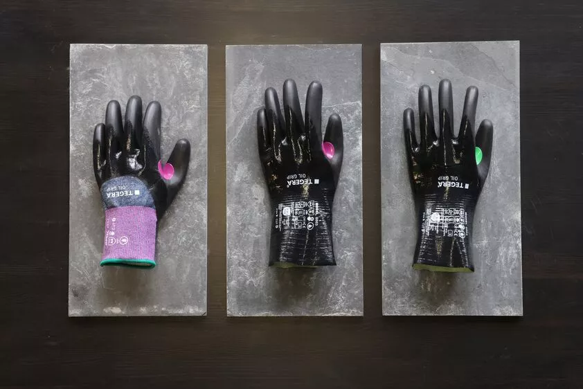 Three TEGERA Oil Grip cut protection gloves