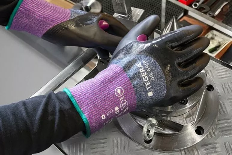 TEGERA 8862 Oil Grip cut protection gloves in use